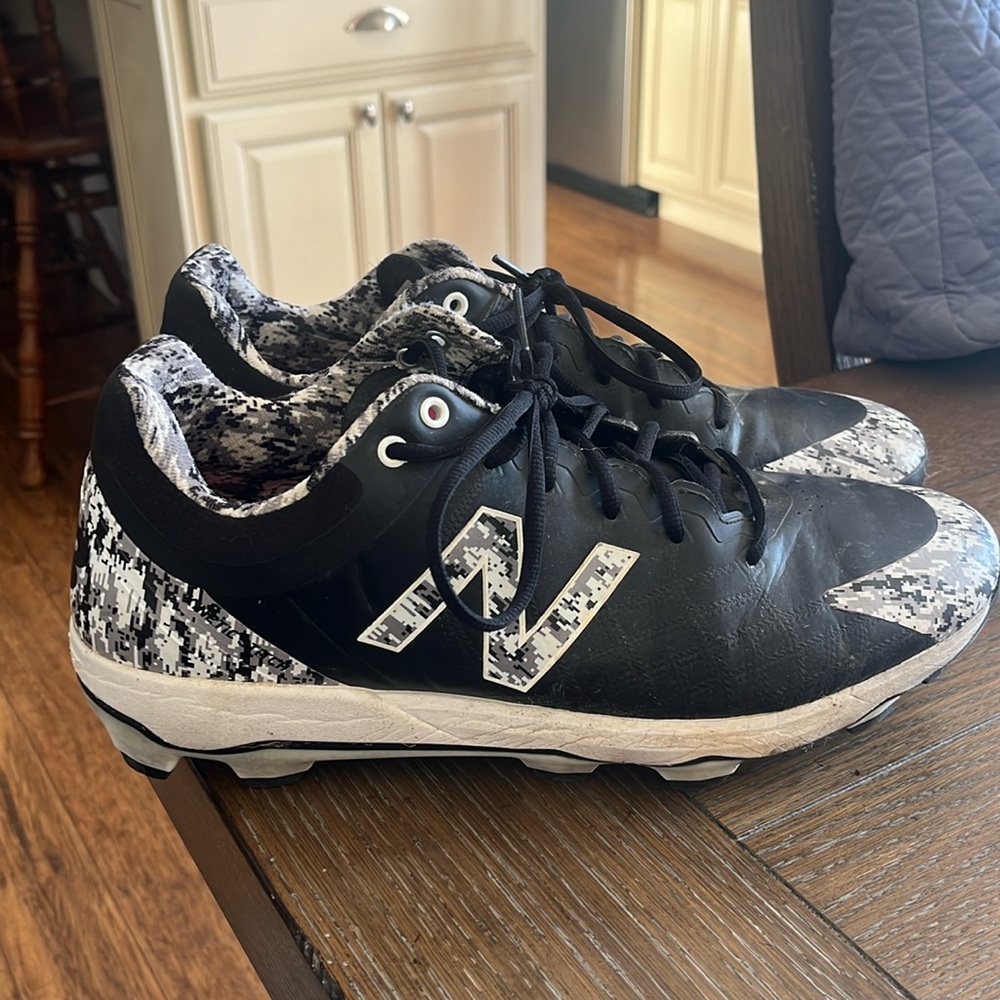 New Balance Men’s molded cleats.  Size 13.  Black and digi-camo.  In good shape.